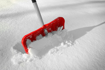 Red shovel for snow removal