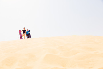 Tourists Sand Skiing In The Desert