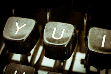 U letter on a vintage typewriter keyboard
