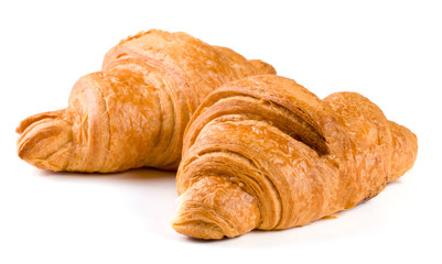 two croissant isolated over a white background closeup