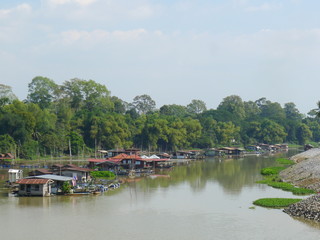 Fototapeta na wymiar Houses along the river in Asia