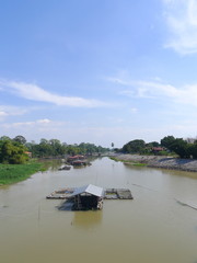 Fototapeta premium Houses along the river in Asia