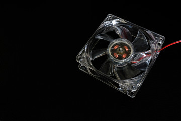 Cooling fan for computer and electronic device on dark background.