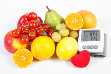 Blood pressure monitor and fruits with vegetables, healthy lifestyle