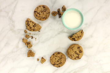Chocolate chips cookies, forming frame with glass of milk
