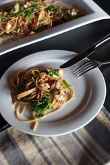 High contrast spaghetti serving with napkin