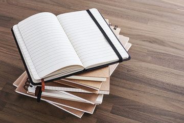 Notebook on wood table background