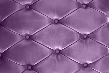 purple leather texture of a couch with leather buttons
