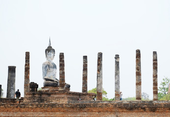 Fototapeta na wymiar Side view of Buddha statue in Wat Maha That , Sukhothai, Thailan