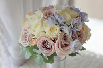 Bridal bouquet of blue delphinium roses close