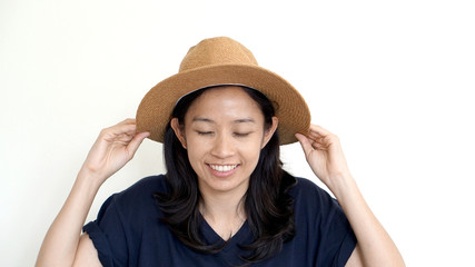 South East Asian girl wearing casual hat, smile and happy on whi