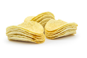 Stacks of paprika flovored poteto chips isolated on white background. Clipping path included in JPEG.