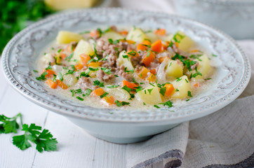 Cheese soup with vegetables and minced meat