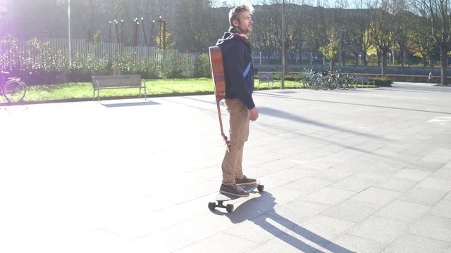 Mature man skateboarding in the street
