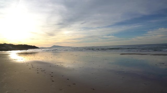 View of beach at low tide, sunset light