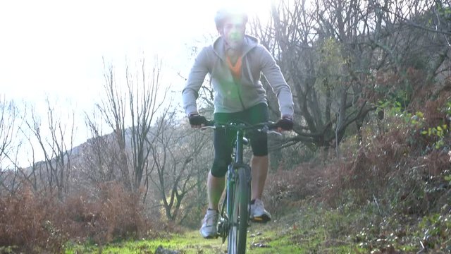 Mature man riding bike in the mountain
