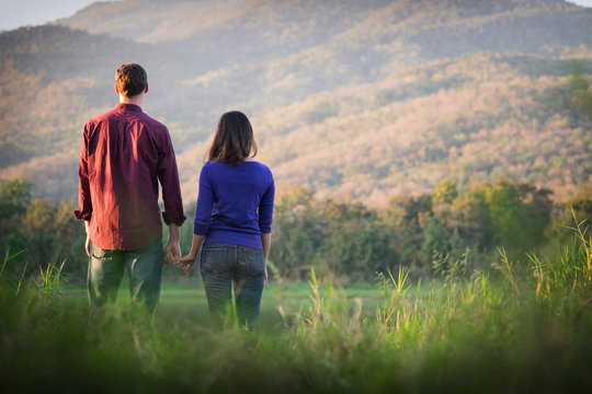 Happy Smiling Romantic couple relaxing in love at the autumn bea