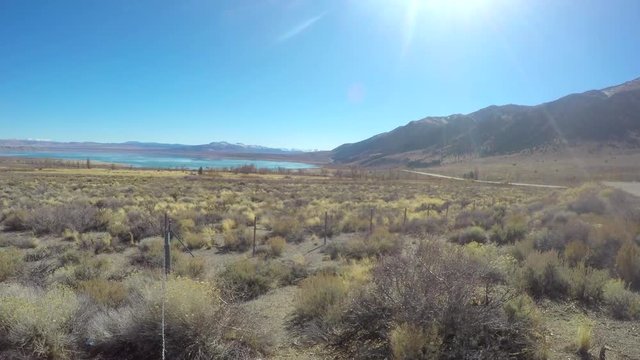 Zooming timelapse of a landscape and the lake, in autumn, at Mono lake, in California, United states of America