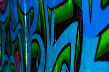 Graffiti on a wall inside of a tunnel