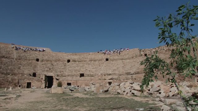 Pan across the amphitheatre at Leptis Magna. the extensive Roman ruins near Al Homs, Libya