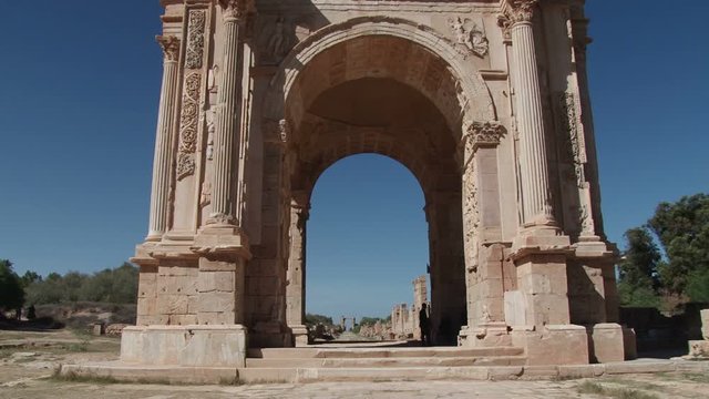 Tilt down the Arch of Septimius Severus in Leptis Magna the extensive Roman ruins near Al Homs, Libya