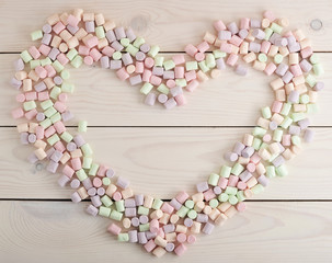 background from the scattered candy marshmallow in heart shape