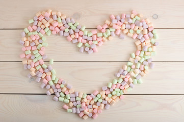 background from the scattered candy marshmallow in heart shape