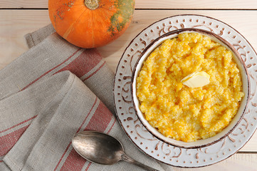 pumpkin porridge with butter and a pumpkin