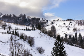 winter landscape with a mountain village in Romania