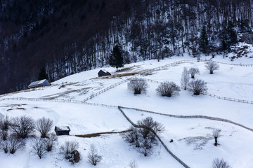 winter landscape with a mountain village in Romania