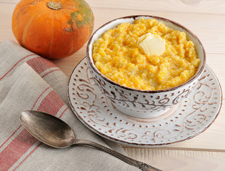 pumpkin porridge with butter and a pumpkin