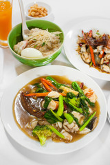 wide rice noodles seafood in thick gravy