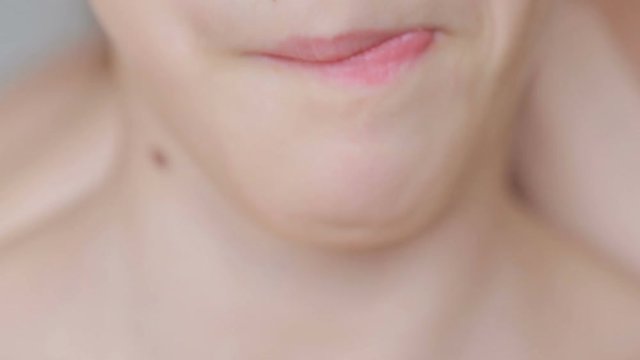 Close-up of a child receives food. eating. bites of sweetness