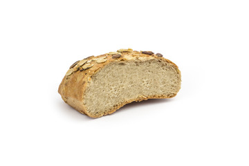 Rustic, organic bread with pumpkin seeds. Clipping path included in JPEG.