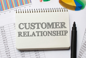 Notebook with Toolls and Notes about Customer Relationship