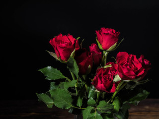 Bouquet of red roses on a black background