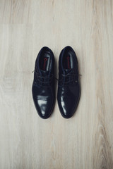 beautiful black leather and lacquered shoes for the groom