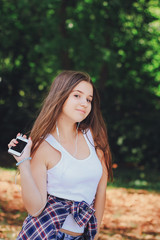 young beautiful girl walking park