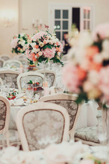 beautifully decorated hall of the restaurant for wedding celebra