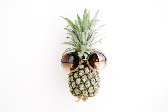 Hipster pineapple in sunglasses. Flat lay, top view