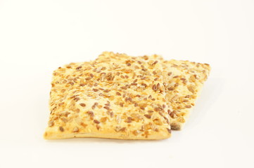 
Dietary cookies with sesame seeds, flax and sunflower isolated on white background