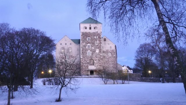 Zooming timelapse of Turun linna, at a snowy winter evening, in Turku, Varsinais-suomi, Finland