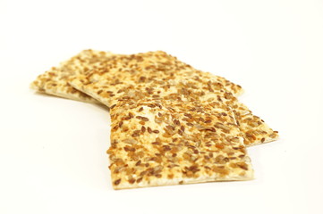 Dietary cookies with sesame seeds, flax and sunflower isolated on white background