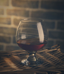 Cognac glass dark retro studio shot toning