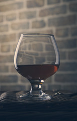 Studio shot toning glass cognac photo