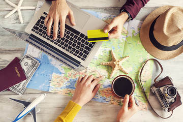 People planning vacation trip with map - obrazy, fototapety, plakaty