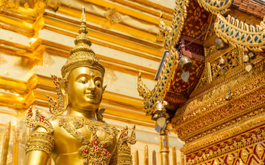 Full gold decor and scene with beautiful golden Buddha statue in golden buddhist temple in Chiang Mai, Thailand