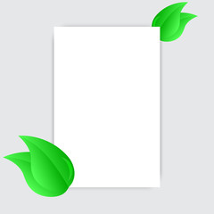 Blank white sheet paper and green fresh spring leaves.