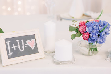 White frame with lettering 'I+U=love