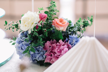 Stunning bouquet of pink and blue hydrangeas and roses